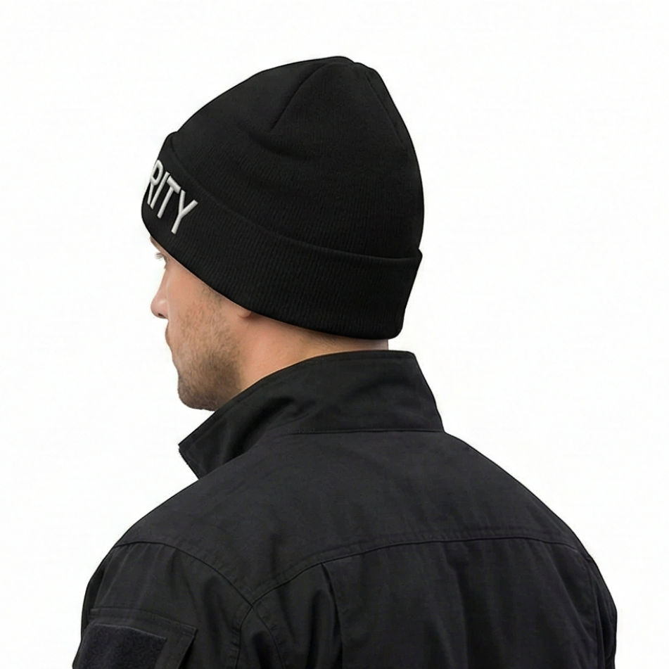 Person wearing a black beanie with 'SECURITY' text