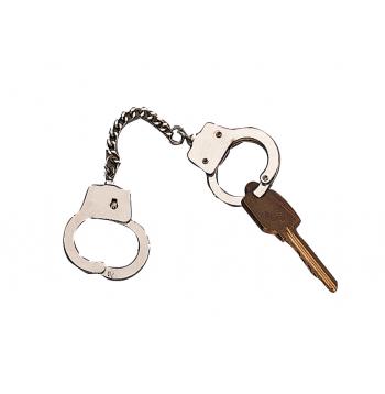 Handcuffs and a key on a white background