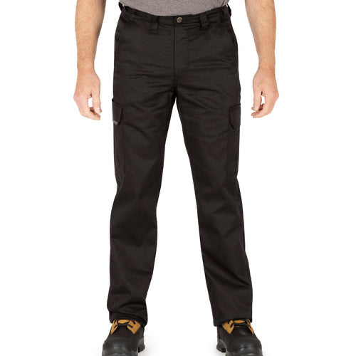 Man wearing black cargo work pants, front view, with waist button closure, front pockets, and side cargo pocket, paired with tan work boots